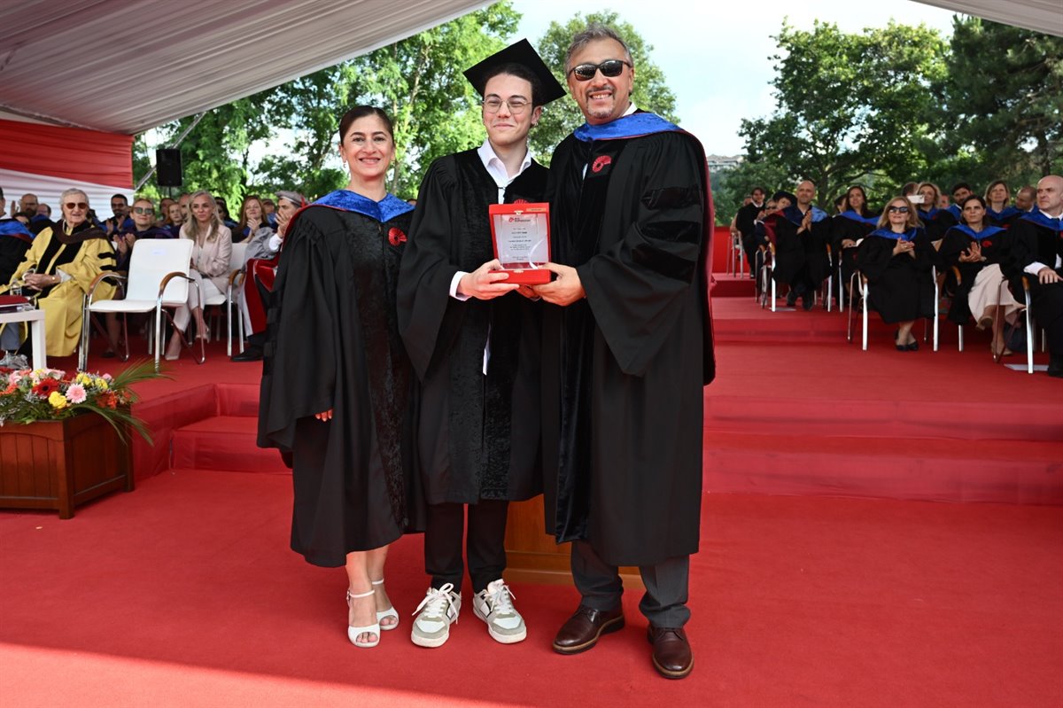 Ege Yiğit Erbil receiving his valedictorian recognition at Koç University’s 2026 commencement
